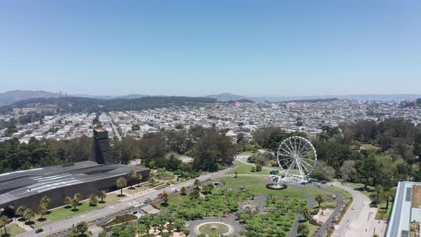 Reverse pullback aerial shot of the Music Concourse at Golden Gate Park in San Francisco. 4K