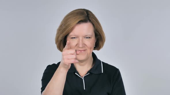 Portrait of Old Woman Pointing at Camera