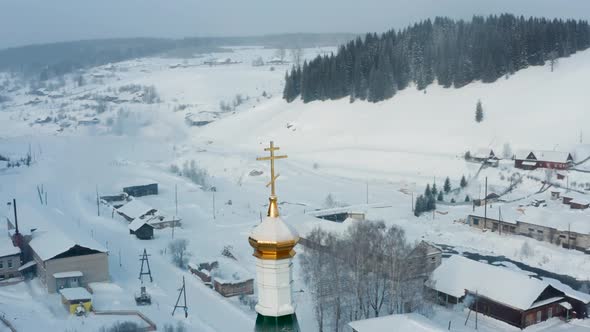 Aerial View of the Church in the Village in Winter