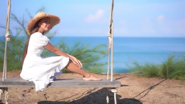 Asian woman enjoy around beautiful beach sea ocean