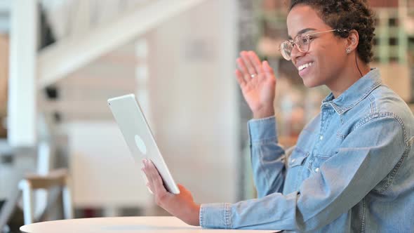 Cheerful African Woman Doing Video Call on Tablet