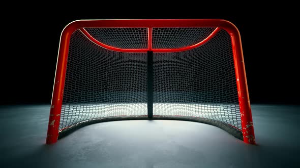 Ice Hockey Net With Puck In Goal. Hitting score with rubber puck. Slow motion.