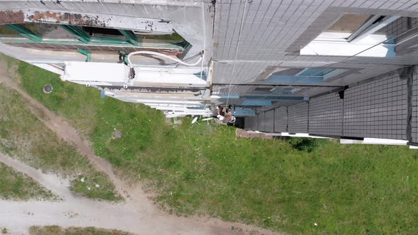 Aerial View Industrial Climber Perform Work on Insulation Side Facade Building