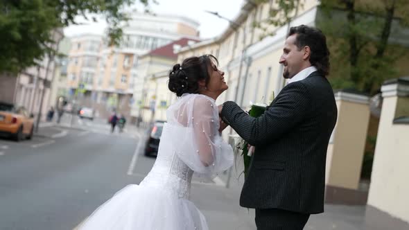 Romantic Just Married Couple on City Street in Wedding Day Happy Man and Woman