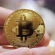 Cryptocurrency Golden Bitcoin Coin in Hands of a Businessman - VideoHive Item for Sale