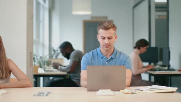 Business Man Working on Computer at Co-working