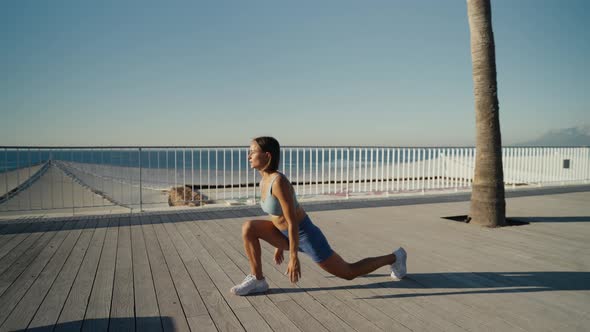 Female Athlete Practicing Lower Body Exercise