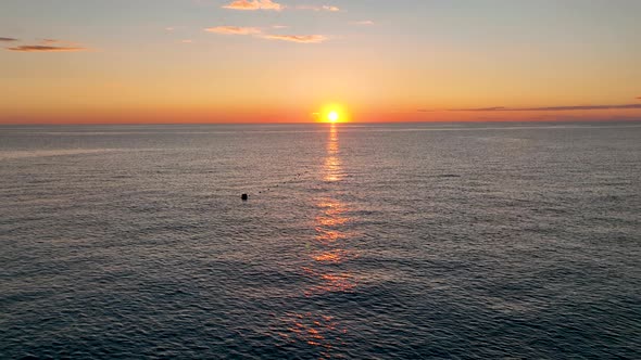 Sunset Over the Sea Flew Away Aerial View 4 K