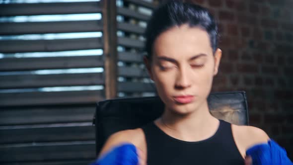 Portrait of Aggressive Brunette Kickboxer Woman Ready to Punch During Fighting POV Shot