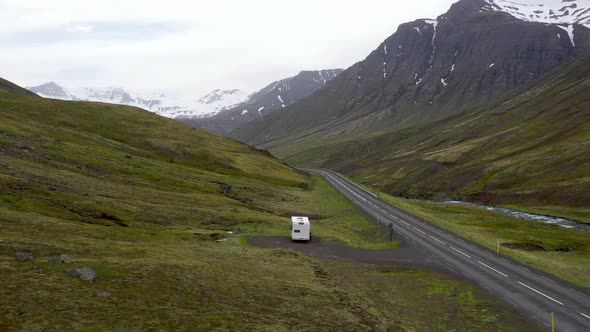 Recreational Vehicle in the Iceland Mountains with drone video moving over.