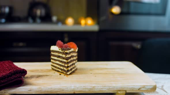 A Slice of Strawberry and Raspberry Cake and Slices Pressed with Chocolate