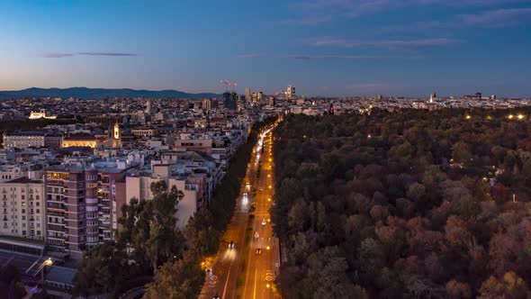 Forwards Fly Above Large City at Twilight