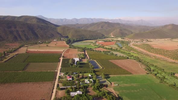 Aerial travel drone view of farms and farming.