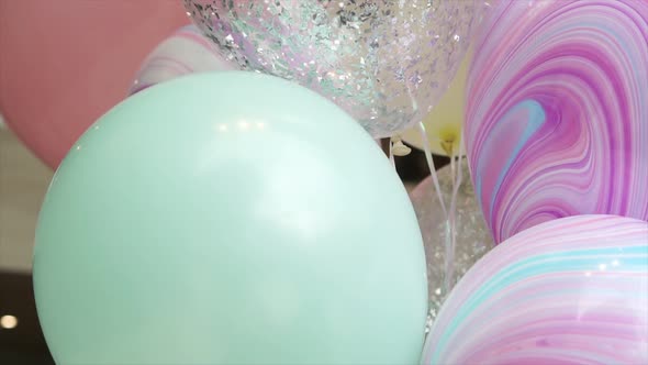 Dolly Shot of Colorful Balloons at Party