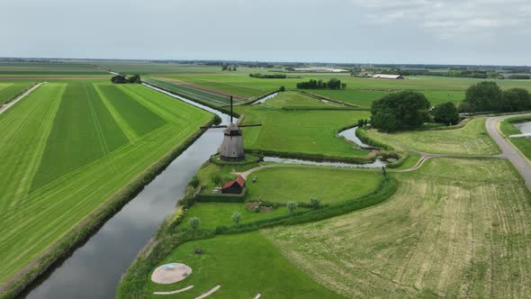 Historic Traditional Typical Dutch Old Windmills Mills on the Rural Countryside in Green Nature