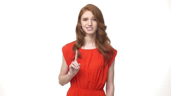 Young Beautiful Caucasian Woman in Gorgeous Orange Dress Standing and Say No Isolated Over White