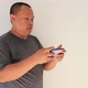Man playing game on his smartphone - VideoHive Item for Sale