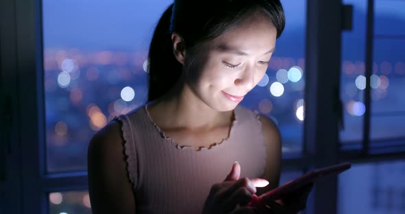 Woman Use of Smart Phone in The Evening at Home 