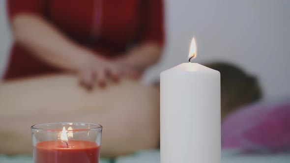 Therapist in Bright Uniform Does Massage to Woman in Salon