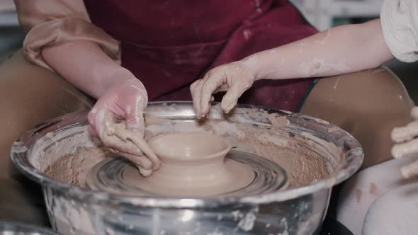 Craftsman Hands Connect the Clay Parts Made of Raw Clay