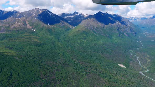 Small airplane flight in the Matanuska Valley west of Palmer Alaska, along the Talkeetna Mountain ra