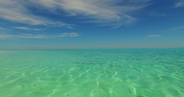 Tropical aerial copy space shot of a paradise sunny white sand beach and blue ocean background in co