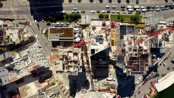 Construction site with cranes. Aerial top down view 