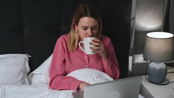 Tired Caucasian Woman Working Laptop on Bed at Home Tired Pretty Woman Work Laptop Then Go To Sleep