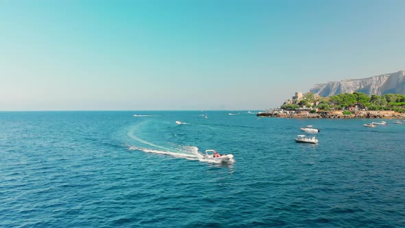 Palermo, SICILY, Italy, High-speed White Passenger Boat Passes By the Camera, Mountains with a Lot