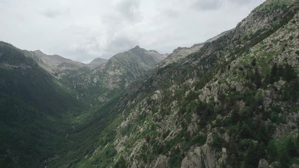 The view of the menacing harsh mountains, the weather looks like a storm.