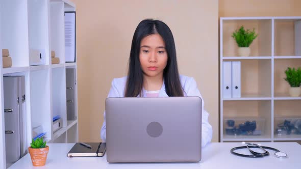 Therapist Working with Medical Records Use Computer