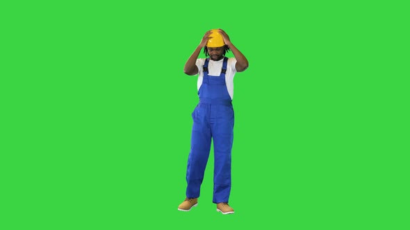 Young Handsome African American Worker Man Wearing Blue Uniform and Security Helmet Changing Poses