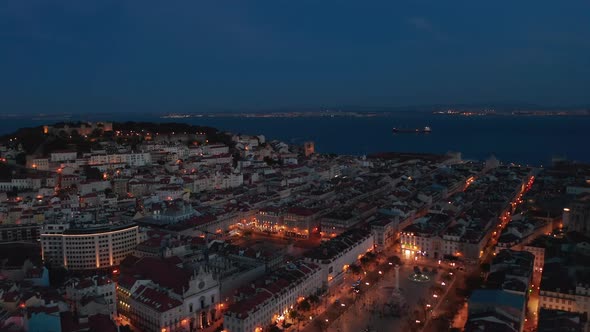 Aerial Night View of Urban City Center of Lisbon with Rows of Traditional Modern Houses Castle on