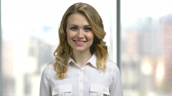 Beautiful Smiling Woman on Blurred Background