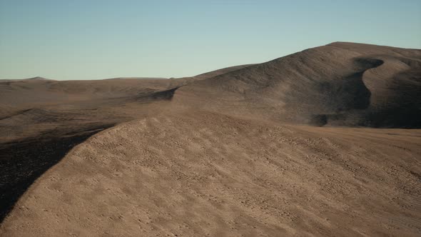 Aerial View on Big Sand Dunes in Sahara Desert at Sunrise alt