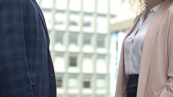 Handshake in the Courtyard of the Office Center