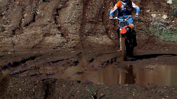 Motocross Biker Splashing Mud