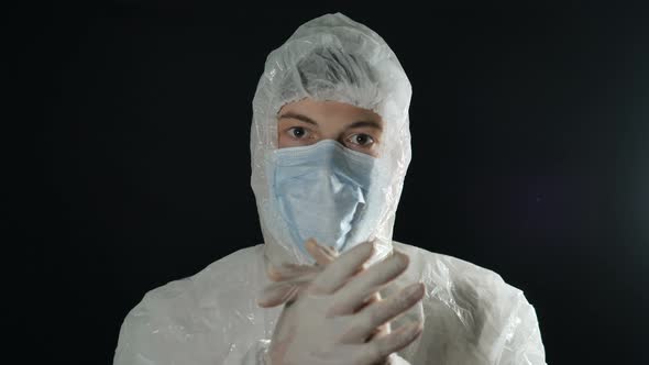 Doctor in Protective Antiviral Suit and Mask Applauds, Fight Against Coronavirus Pandemic Covid-19