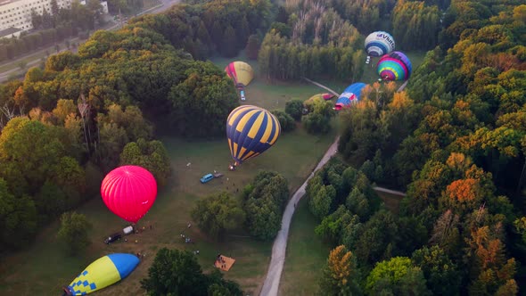 Hot Air Balloons Preparing for Takeoff From Park at Summer Sunrise Hyperlapse 