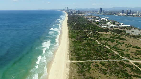 Distant view of waves slowly rolling to the perfect beaches of Surfers Paradise, Gold Coast, Queensl