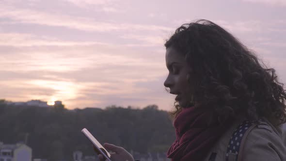 Young Lady Reading Message on Smartphone With Smile on Face Social Networks