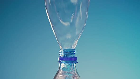 Water Pouring Out of an Upside Down Bottle