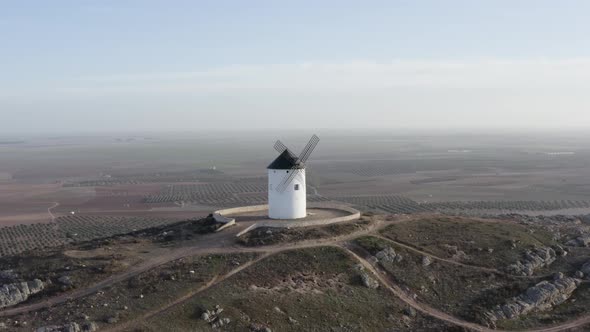 From above white windmill on field