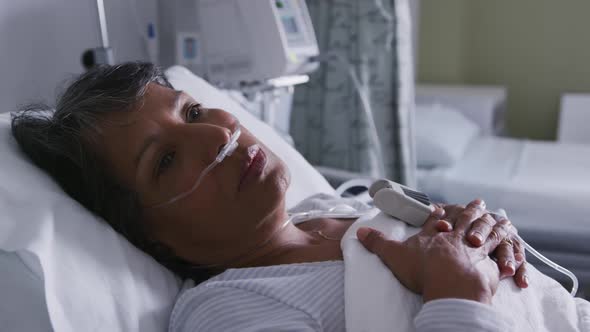 Woman resting in a hospital bed 4k