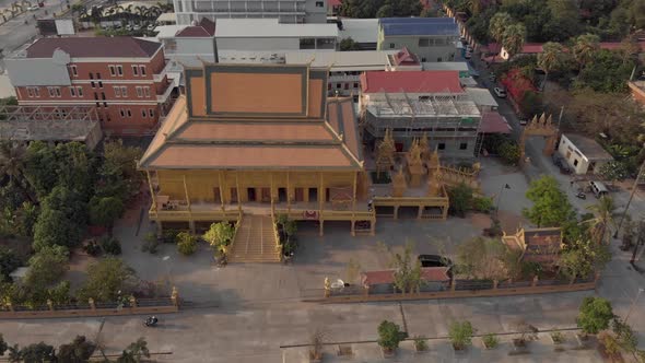 Top view of Golden Temple of Phnom Penh in Cambodia - Aerial Orbit point of interest shot
