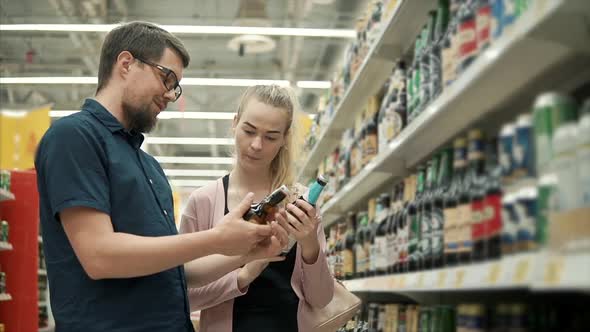 Couple Buying Beverages in Store