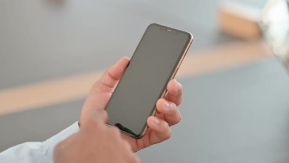 African Man Using Smartphone Rear View