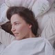 Delighted Woman Stretching Arms on Bed - VideoHive Item for Sale