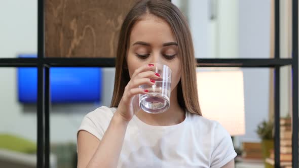 Portrait of Young Girl Drinking Water