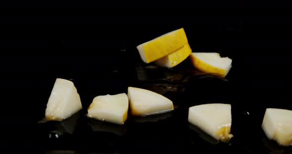 Slices of Melon Fall on the Water Splashes